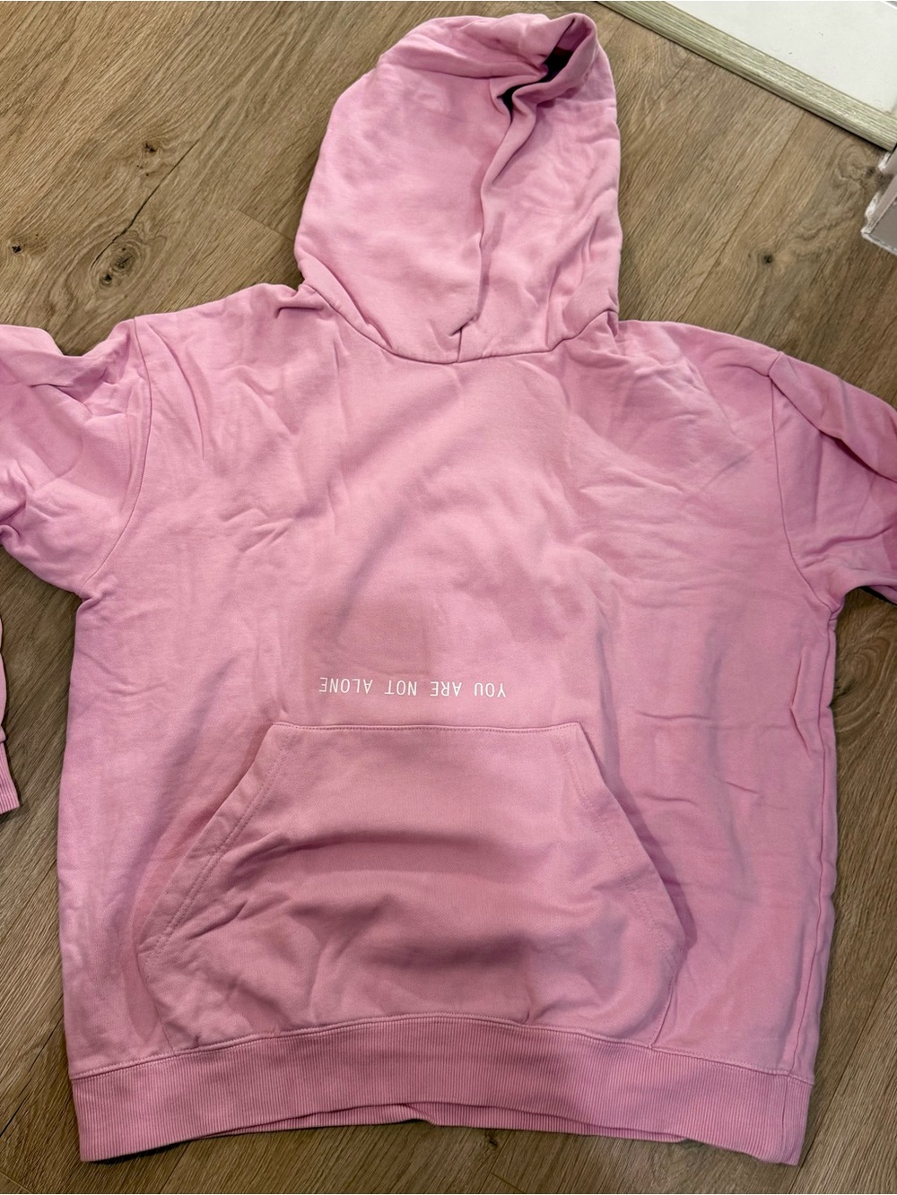Kids Pink Hooded Sweatshirt with 'You Are Not Alone' Text